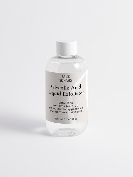 A clear plastic bottle with a white cap containing Glycolic Acid Liquid Exfoliator, labeled for skincare use.