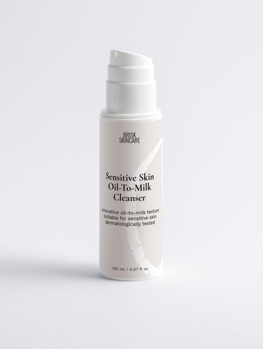 A pump bottle of Sensitive Skin Oil-To-Milk Cleanser for facial cleansing, white and clean with minimalist design.