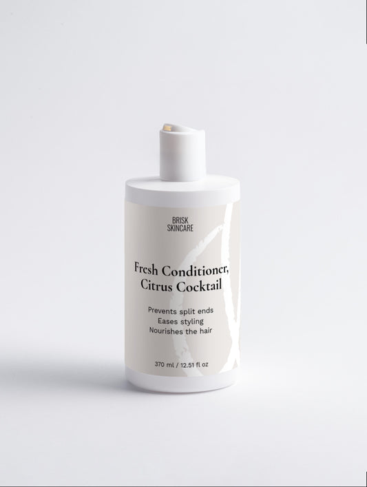 A white bottle of Fresh Conditioner, Citrus Cocktail by Dux Ducis, designed for nourishing hair ends and preventing split ends.
