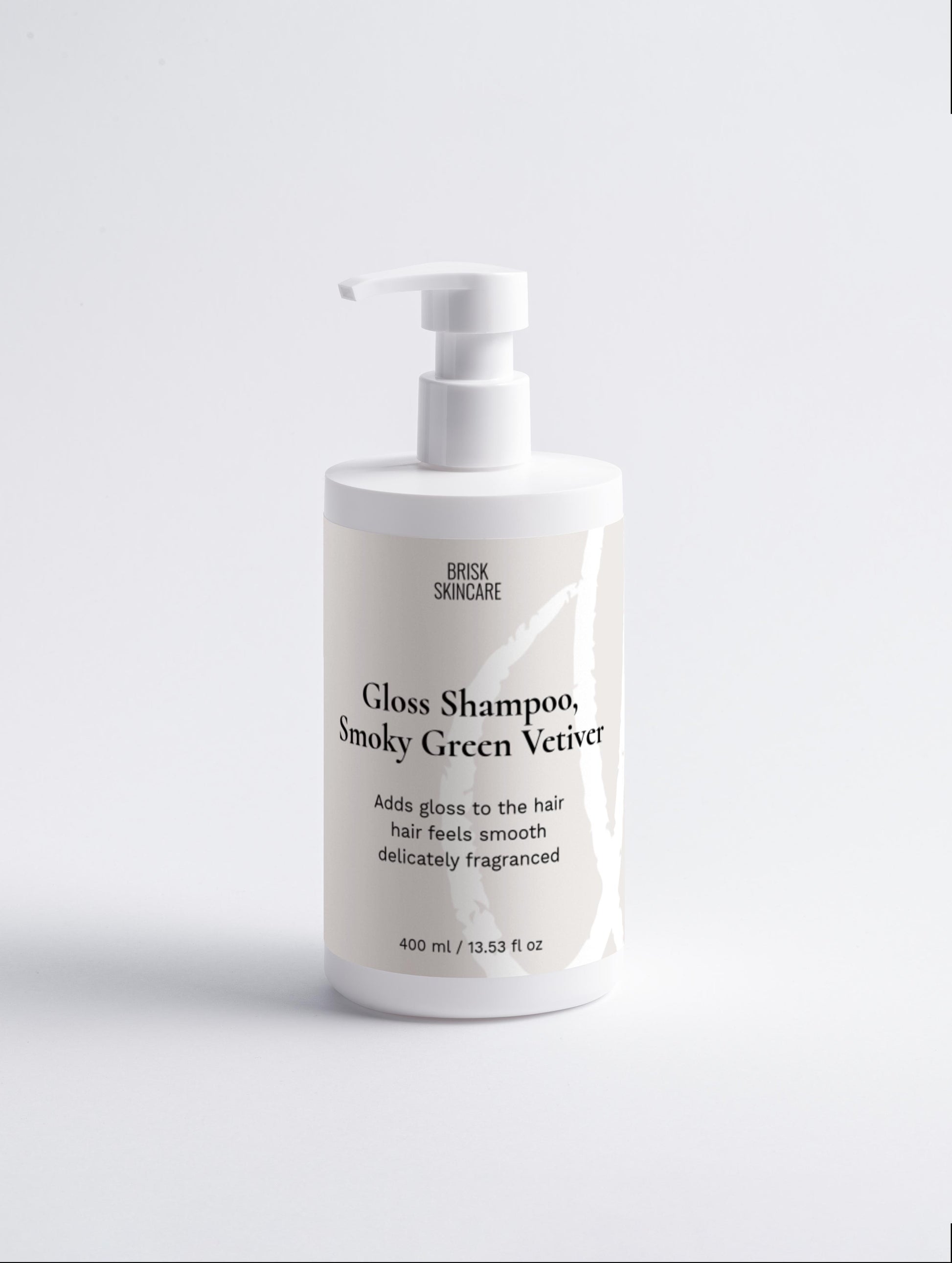 A white pump bottle of Gloss Shampoo with Smoky Green Vetiver label, indicating it is a haircare product.