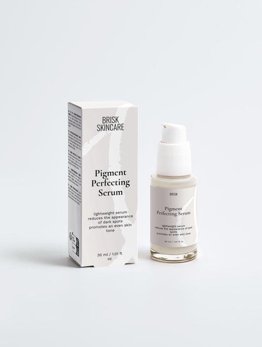 A white bottle of Pigment Perfecting Serum with a pump dispenser, next to its packaging box with product information.