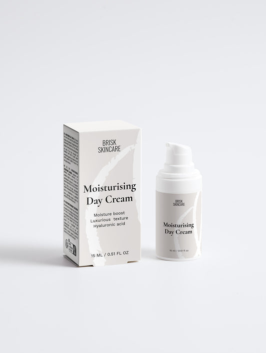 A white pump bottle of Moisturising Day Cream alongside its packaging box.